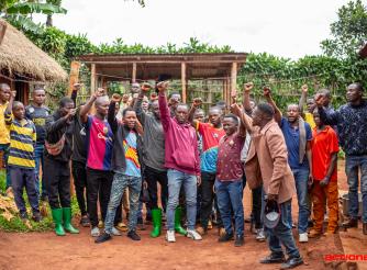 Community members in Walungu, South Kivu, raise their hands after a Community Scorecard meeting assessing the impact of the GAFSP-supported RENUGL project. The session brought farmers together to reflect on challenges affecting agriculture, markets and security, highlighting how collective dialogue and local action are essential to building resilience beyond agricultural production.