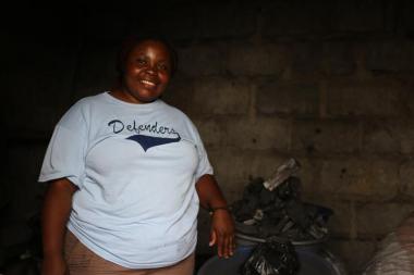 Brigitte sells charcoal to earn income 